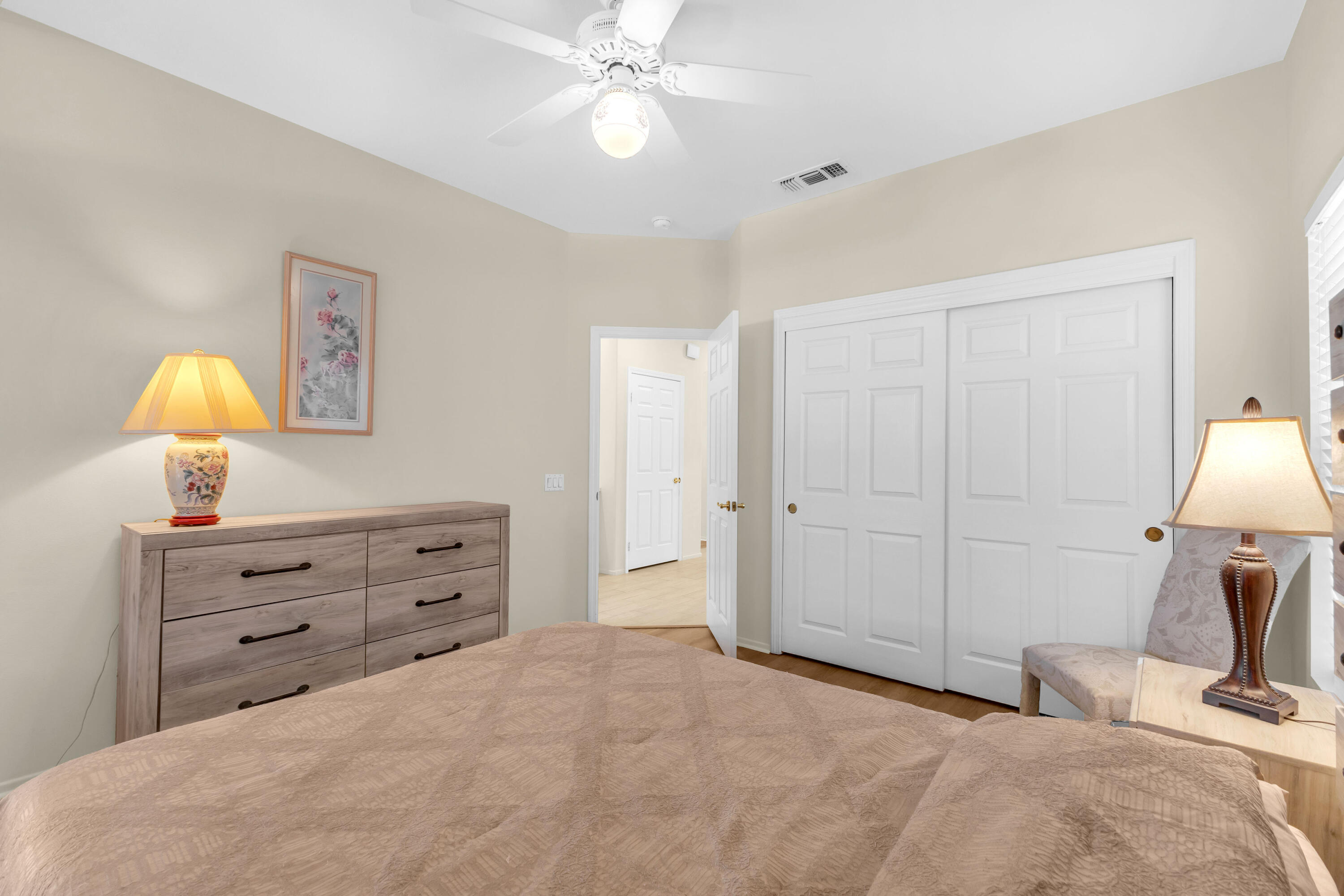 37468 Westridge Avenue Palm Desert, CA 92211 - Photo 26 of 40 a bedroom with a bed and a lamp on dresser