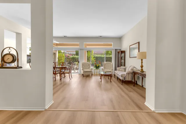 a view of a livingroom with furniture and a kitchen
