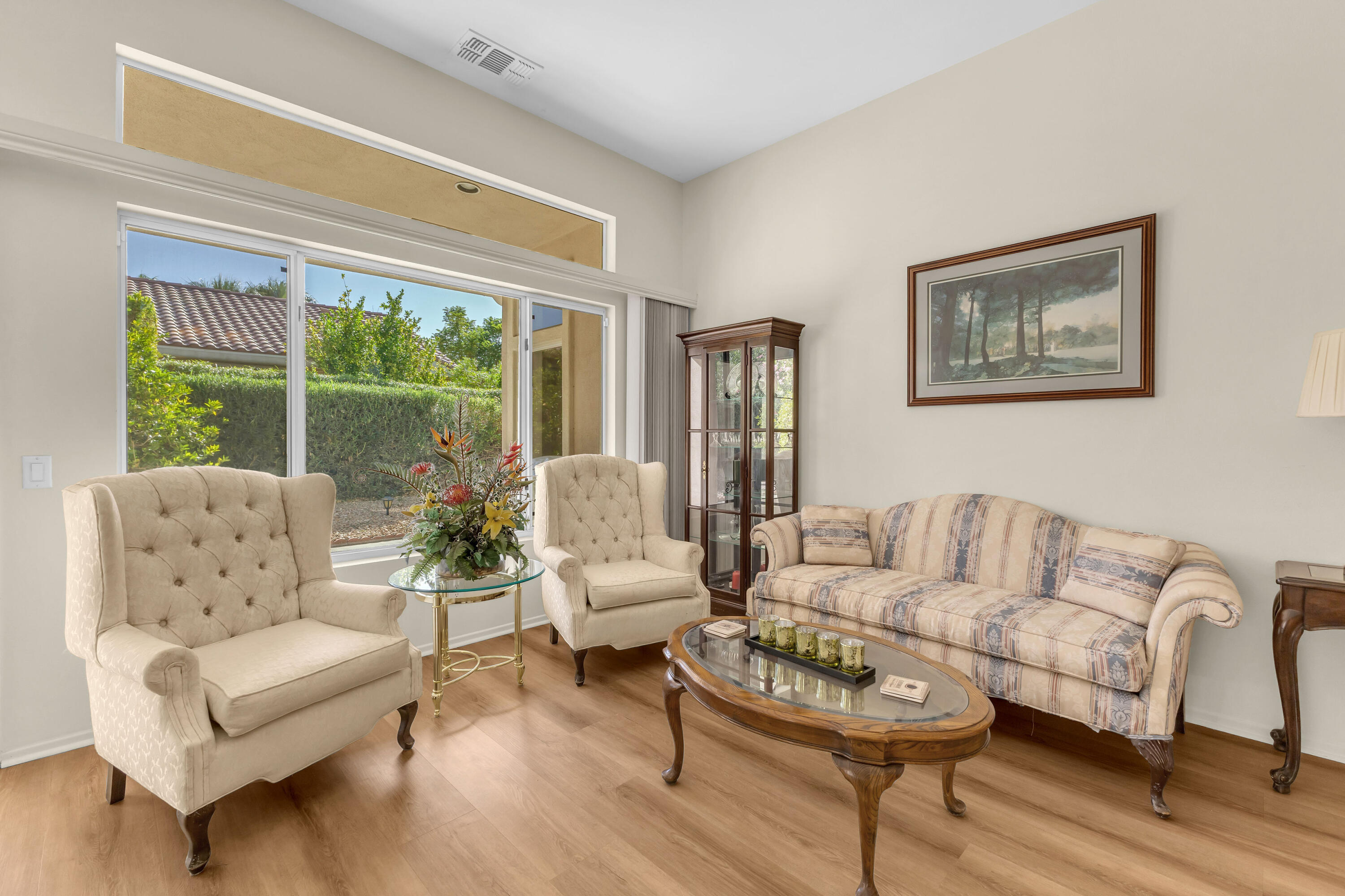 37468 Westridge Avenue Palm Desert, CA 92211 - Photo 8 of 40 a living room with furniture and a large window