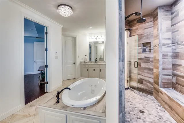 a bathroom with a sink a mirror and a shower