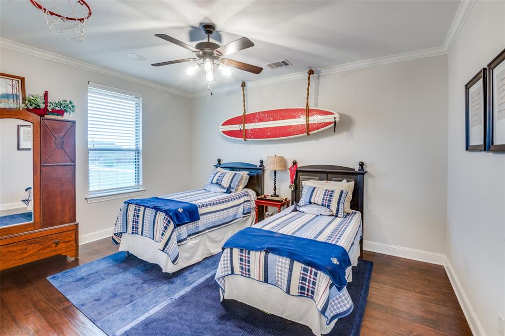 1404 Cumberland Drive Corsicana, TX 75110 - Photo 30 of 40 a bedroom with furniture and a wooden floor