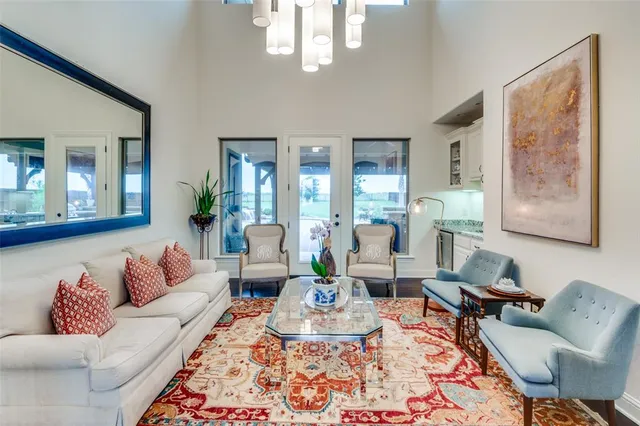 a living room with furniture or couch and a large window