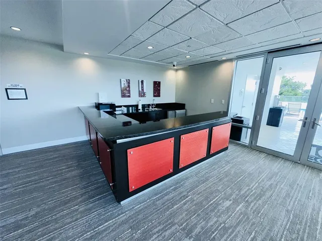 a view of a house with a backyard porch and sitting area