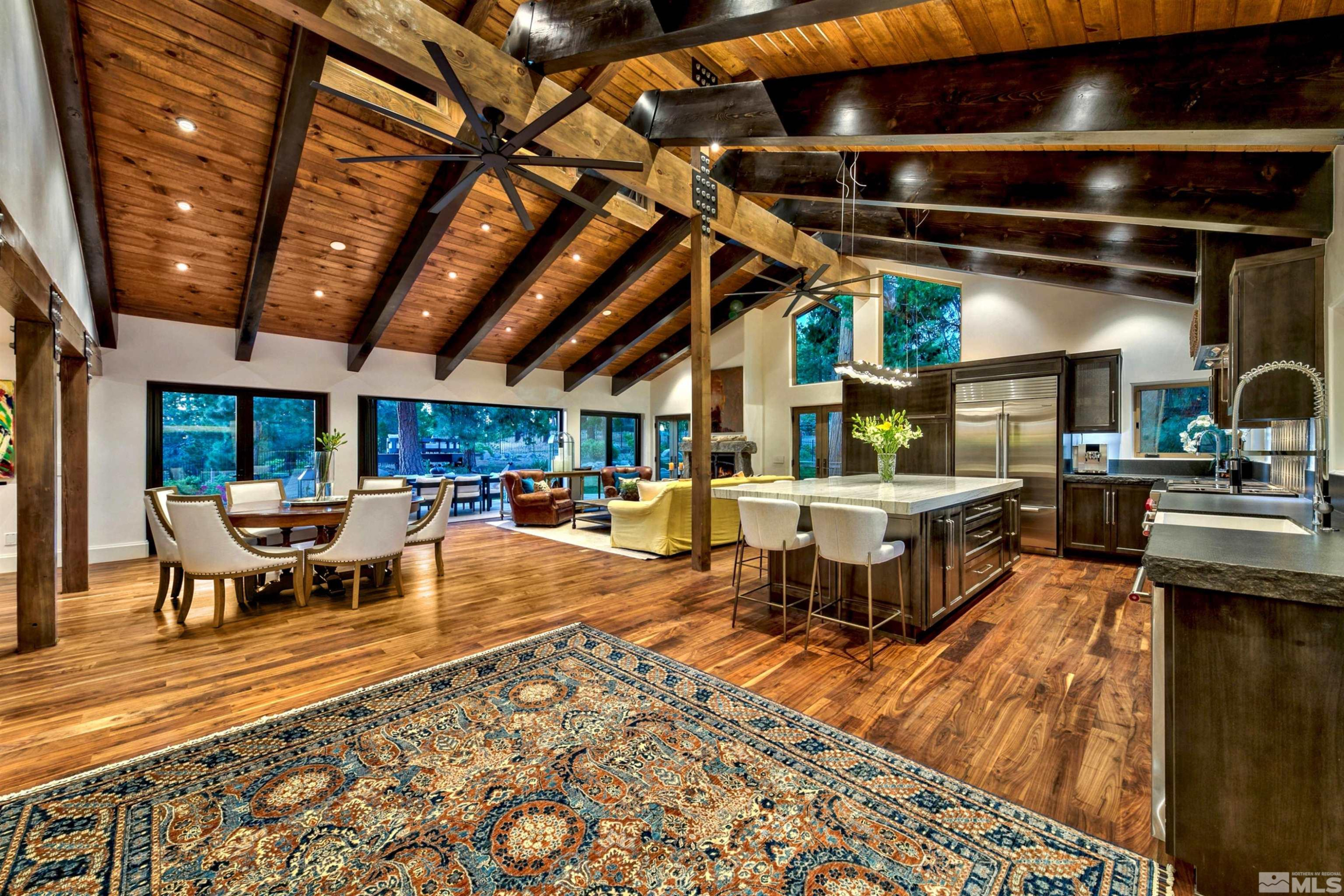 340 Ute Way Stateline, NV 89449 - Photo 11 of 40 a living room with furniture a rug and white walls