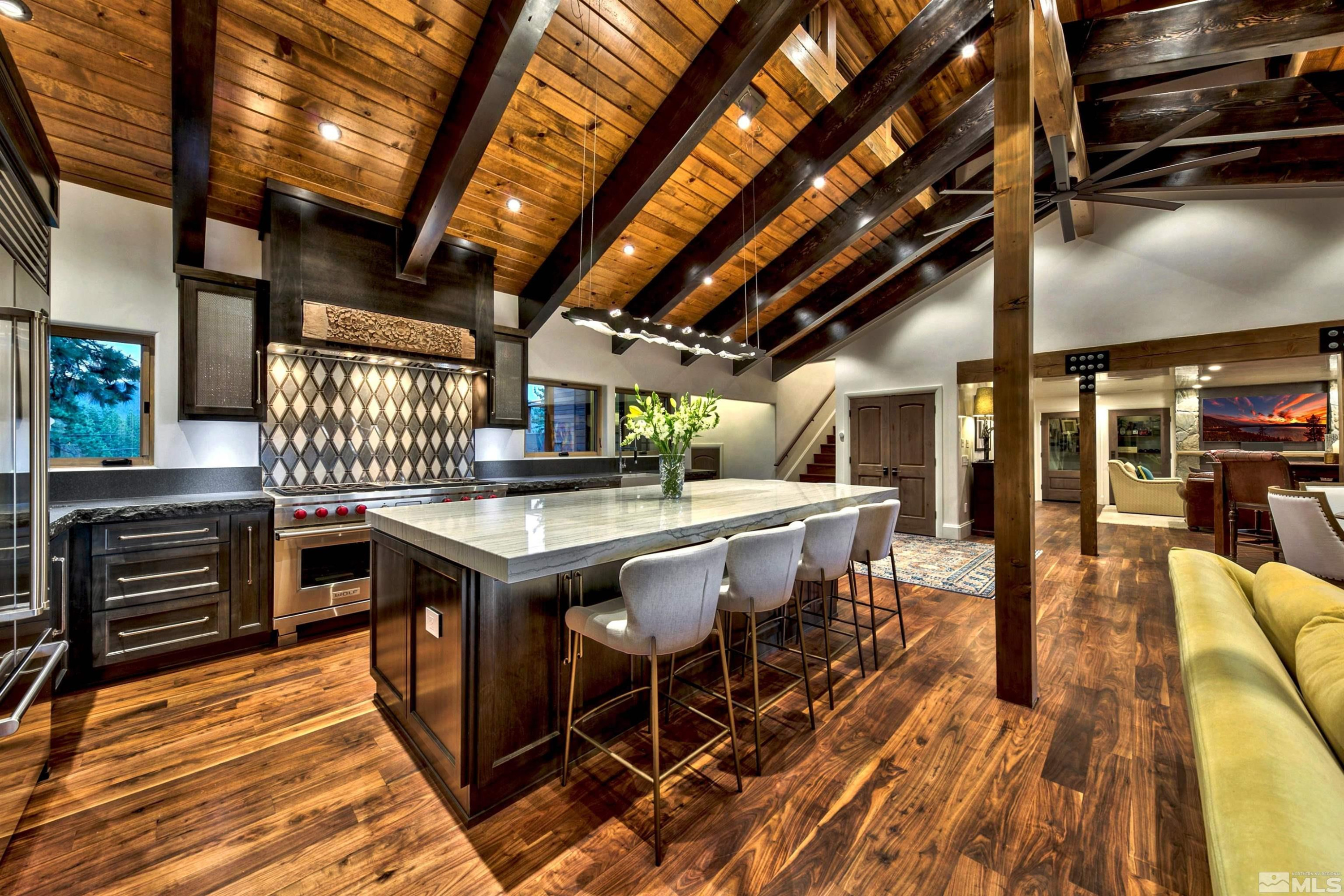 340 Ute Way Stateline, NV 89449 - Photo 20 of 40 a open kitchen with stainless steel appliances granite countertop a stove a sink and dishwasher