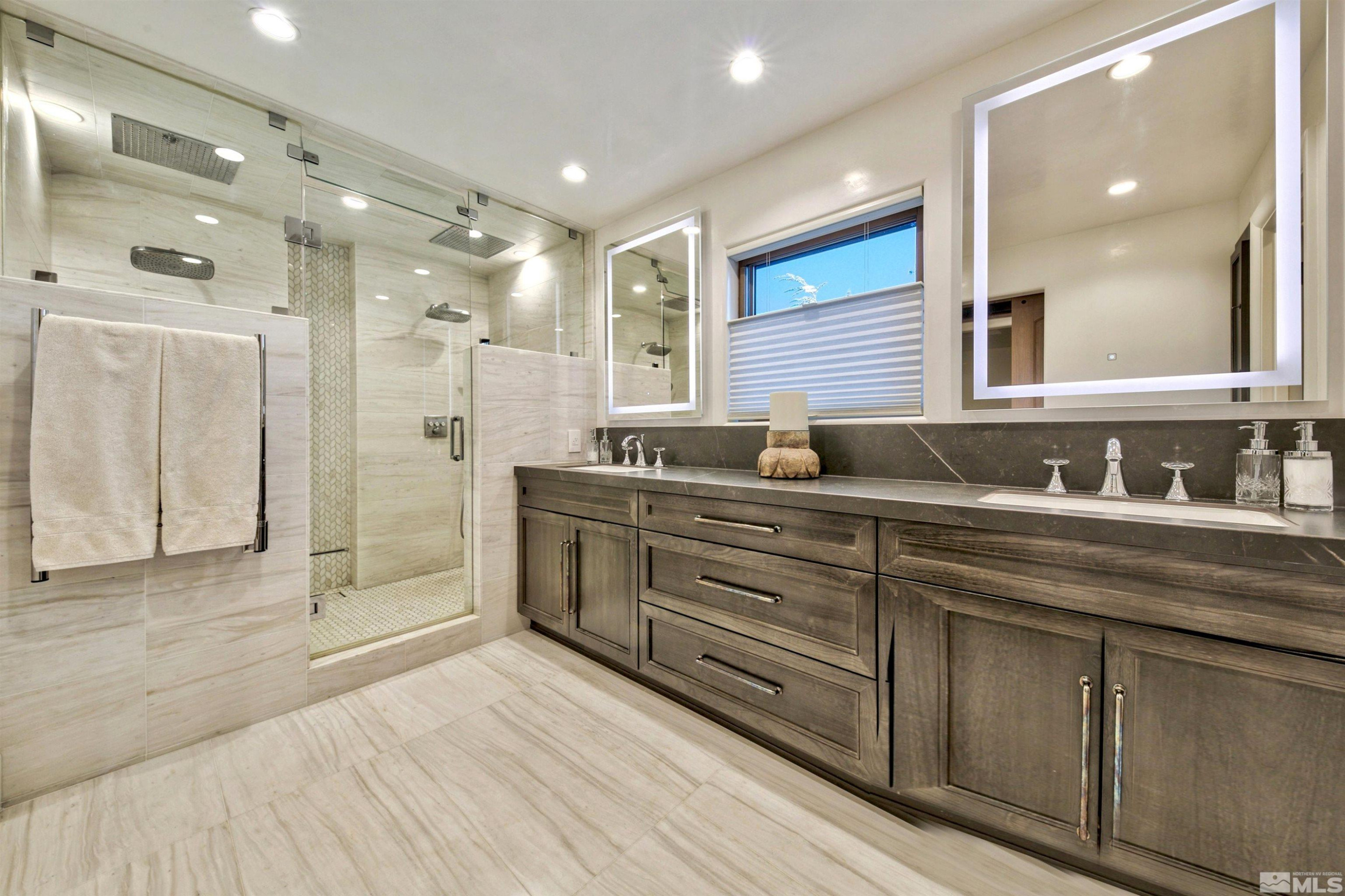 340 Ute Way Stateline, NV 89449 - Photo 35 of 40 a bathroom with double vanity sinks and a shower