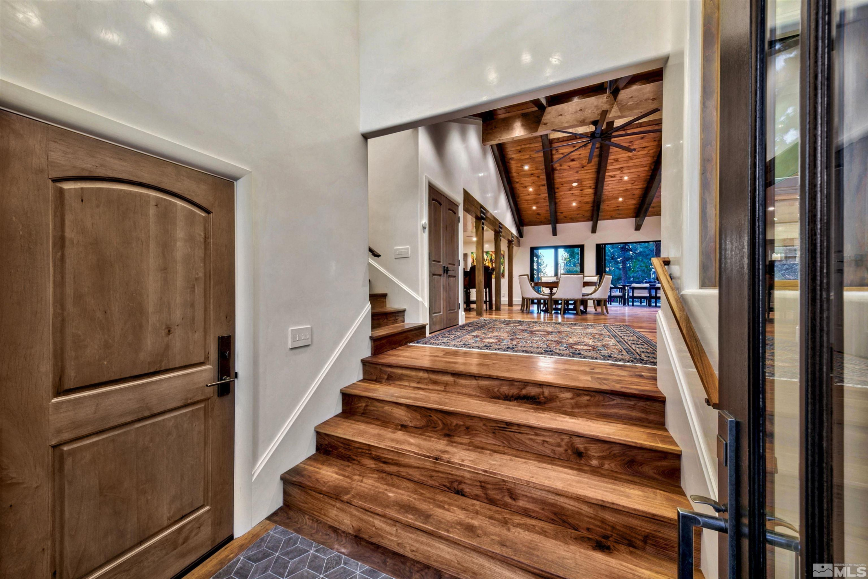 340 Ute Way Stateline, NV 89449 - Photo 10 of 40 a view of staircase with lots of frames on wall and a large window
