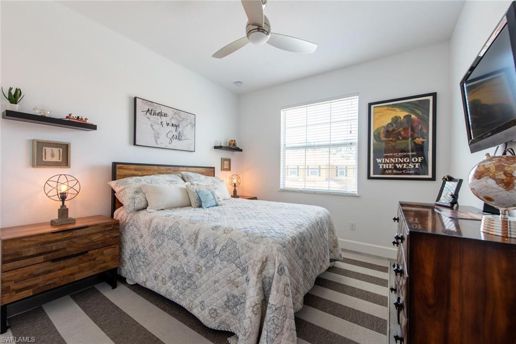 6521 Monterey Point, Unit 203 Naples, FL 34105 - Photo 11 of 17 a bedroom with bed cabinet and window