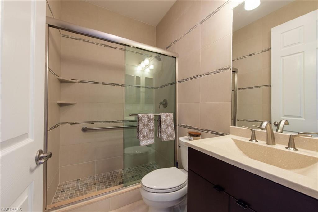 6521 Monterey Point, Unit 203 Naples, FL 34105 - Photo 12 of 17 a bathroom with a sink toilet and shower