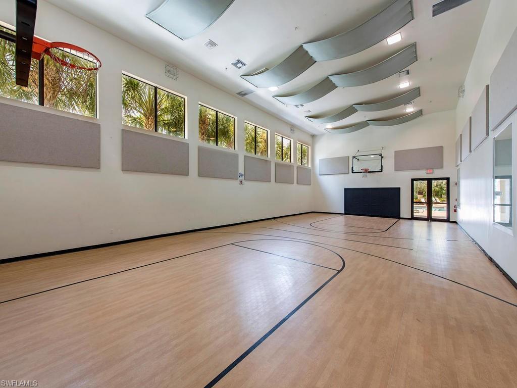 6521 Monterey Point, Unit 203 Naples, FL 34105 - Photo 16 of 17 a view of an empty room with a window and wooden floor