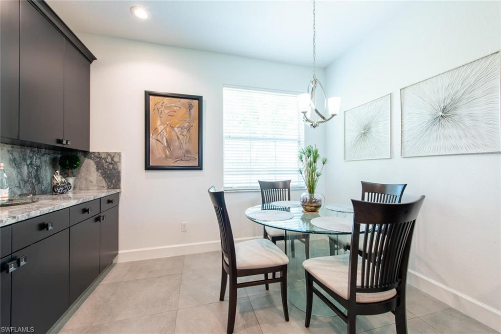 6521 Monterey Point, Unit 203 Naples, FL 34105 - Photo 4 of 17 a dining room with furniture and window
