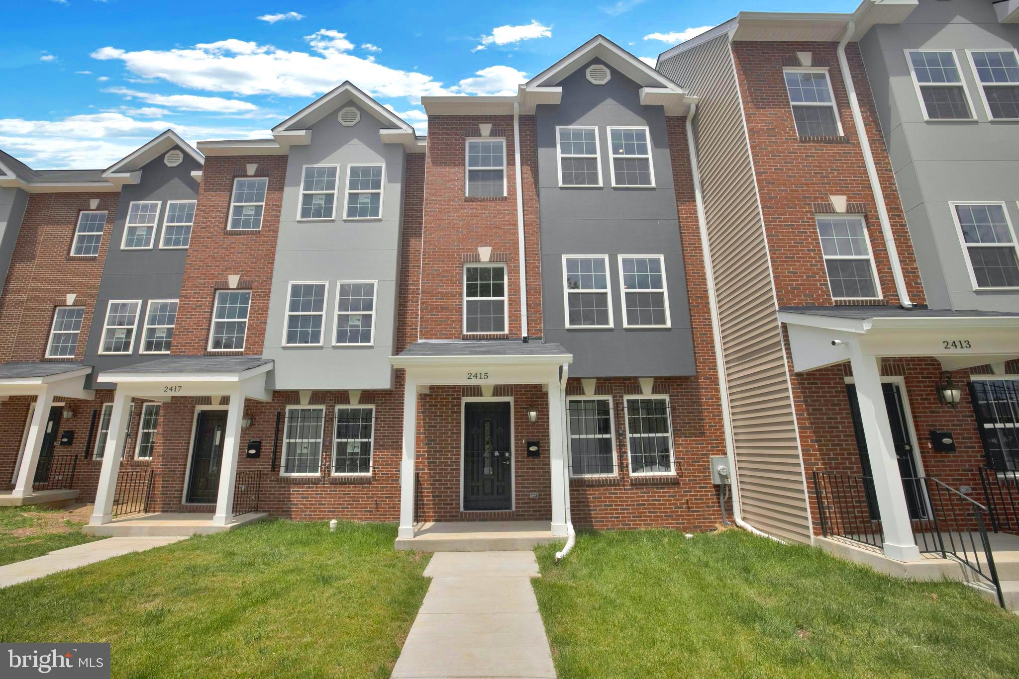 2417 Elvans Road Southeast Washington, DC 20020 - Photo 1 of 48 a front view of a house with a yard
