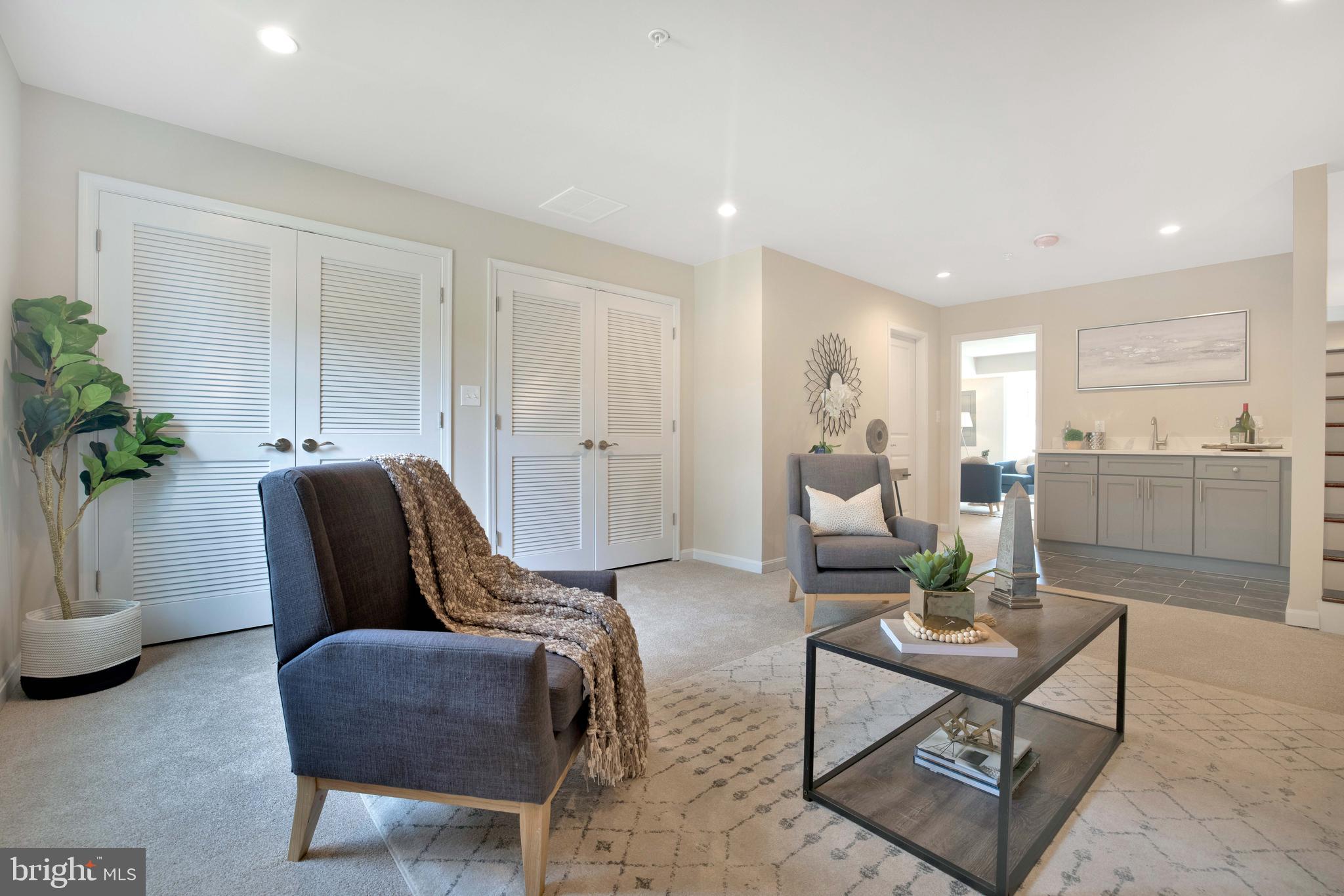 2417 Elvans Road Southeast Washington, DC 20020 - Photo 13 of 48 a living room with furniture potted plant and kitchen view