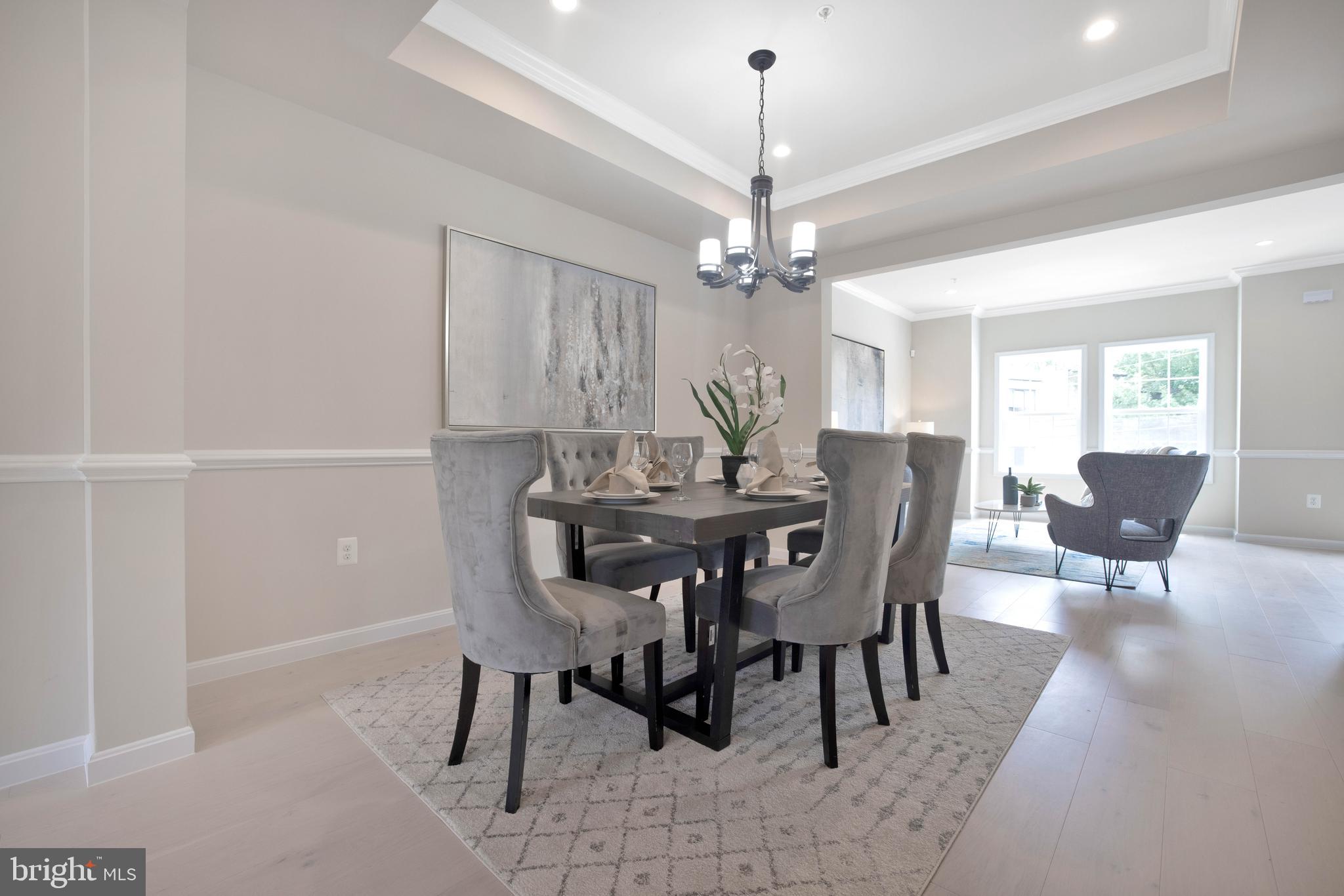 2417 Elvans Road Southeast Washington, DC 20020 - Photo 16 of 48 a view of a dining room with furniture window and wooden floor
