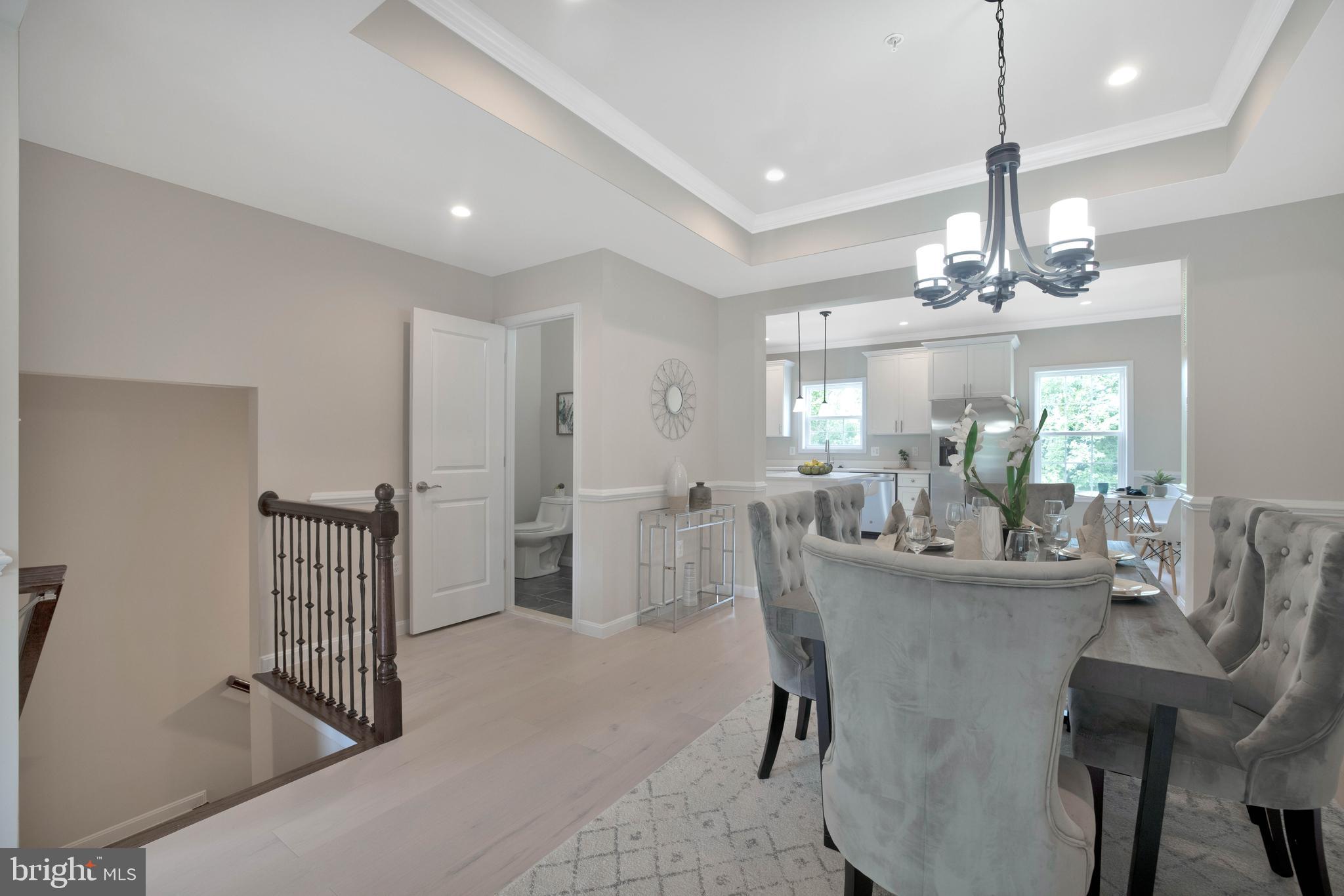 2417 Elvans Road Southeast Washington, DC 20020 - Photo 18 of 48 a dining room with furniture a chandelier and window