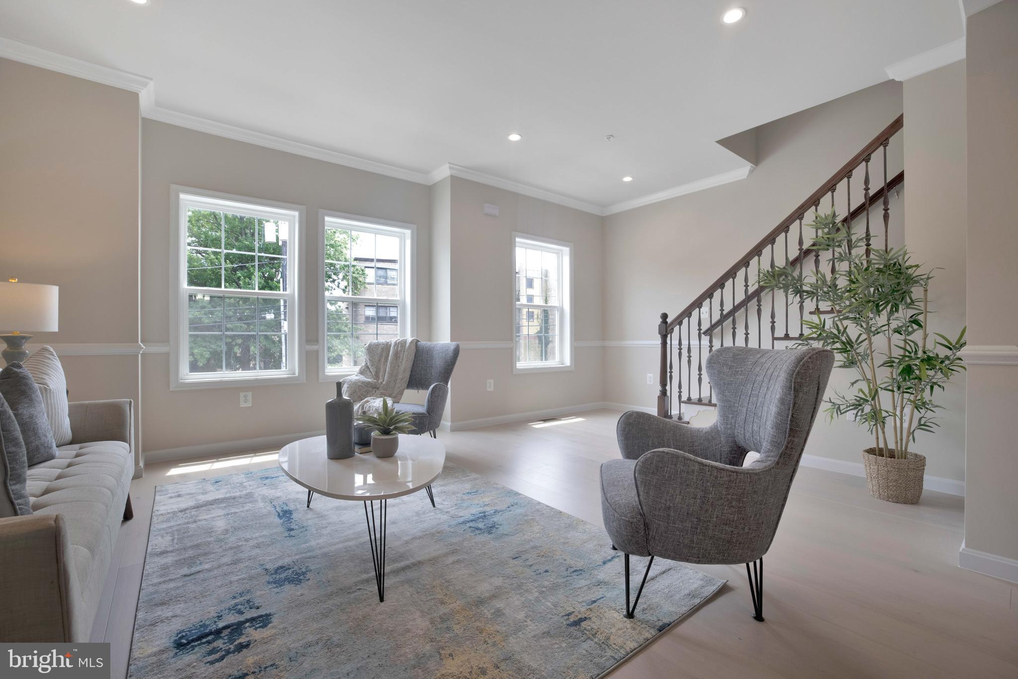 2417 Elvans Road Southeast Washington, DC 20020 - Photo 19 of 48 a living room with furniture and a potted plant