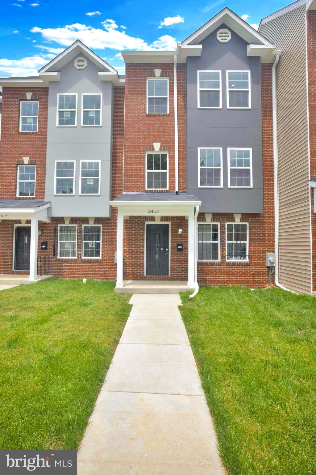 2417 Elvans Road Southeast Washington, DC 20020 - Photo 2 of 48 a front view of a house with garden