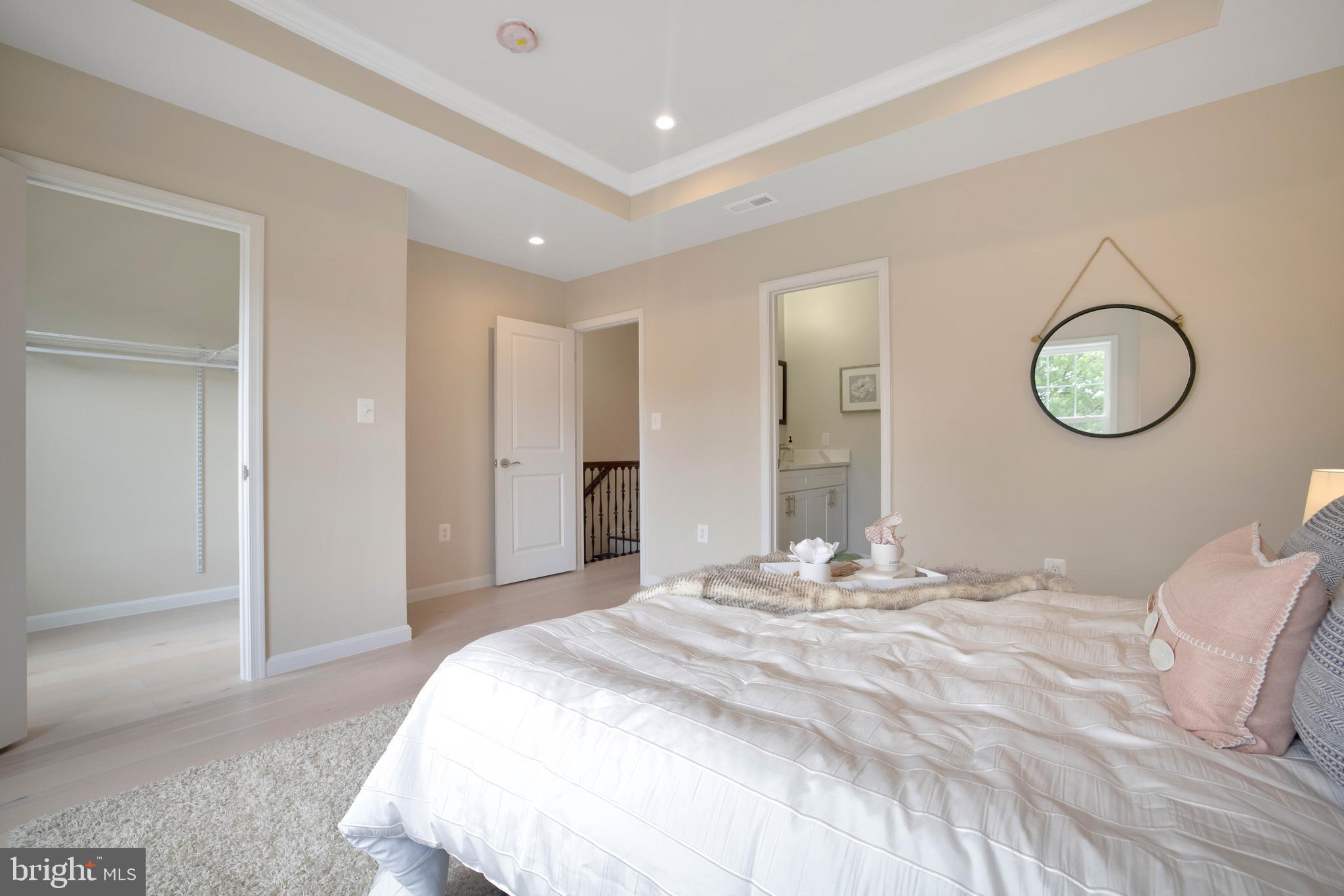 2417 Elvans Road Southeast Washington, DC 20020 - Photo 40 of 48 a bedroom with a bed and a chandelier