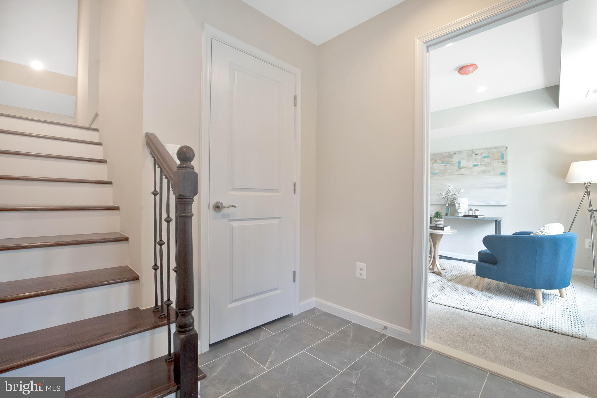 2417 Elvans Road Southeast Washington, DC 20020 - Photo 9 of 48 a view of hallway with stairs and wooden floor