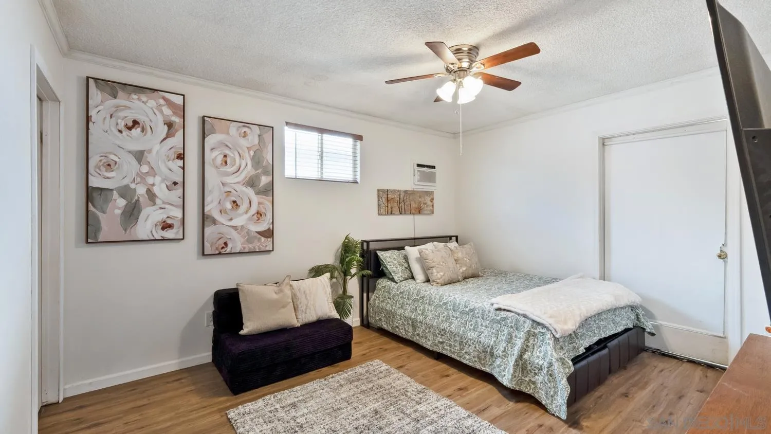 445 Kempton Street Spring Valley, CA 91977 - Photo 23 of 56 a bedroom with a bed and a couch