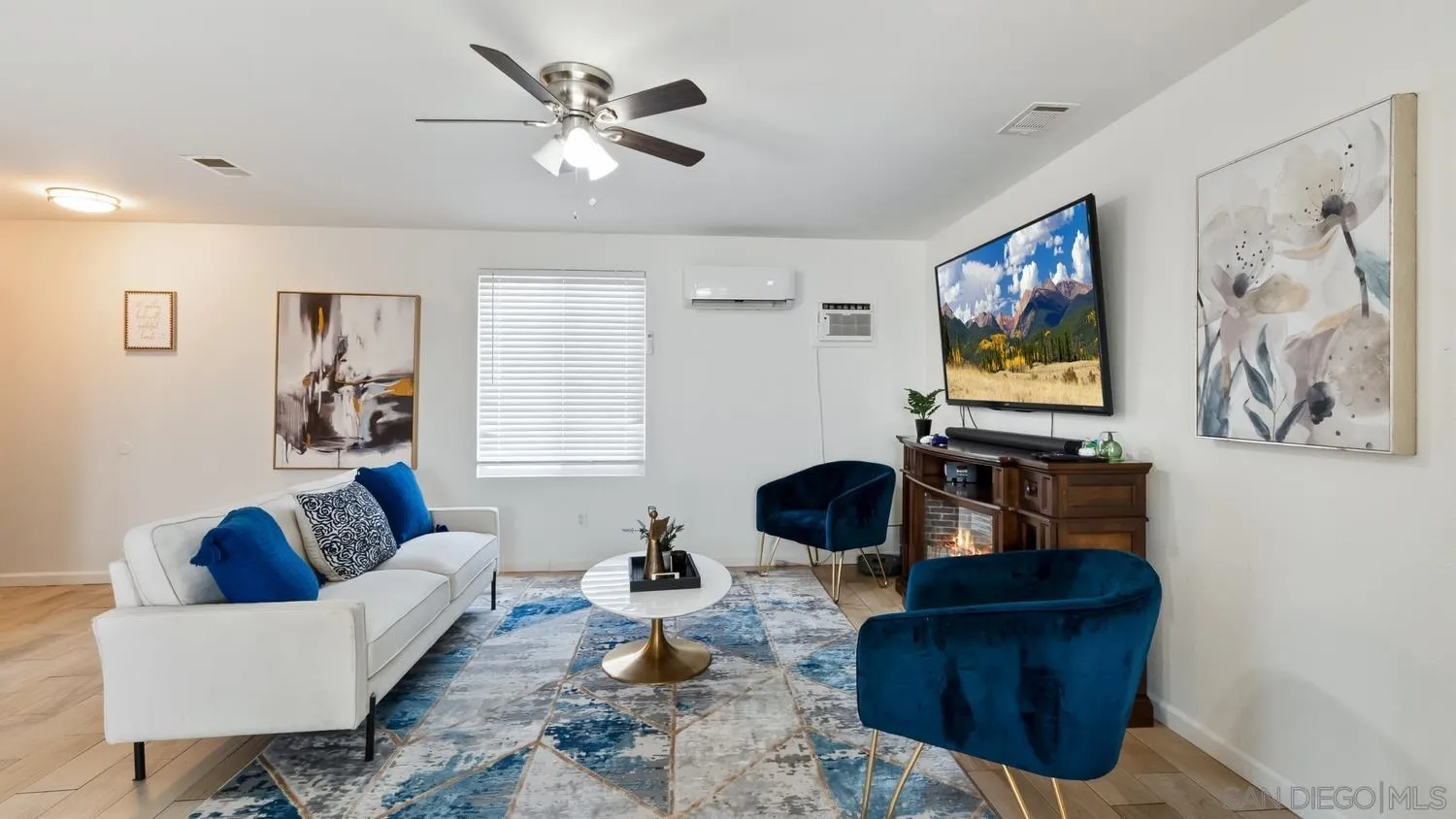 445 Kempton Street Spring Valley, CA 91977 - Photo 6 of 56 a living room with furniture and a flat screen tv
