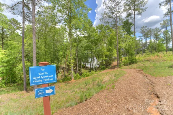 a sign board with a yard