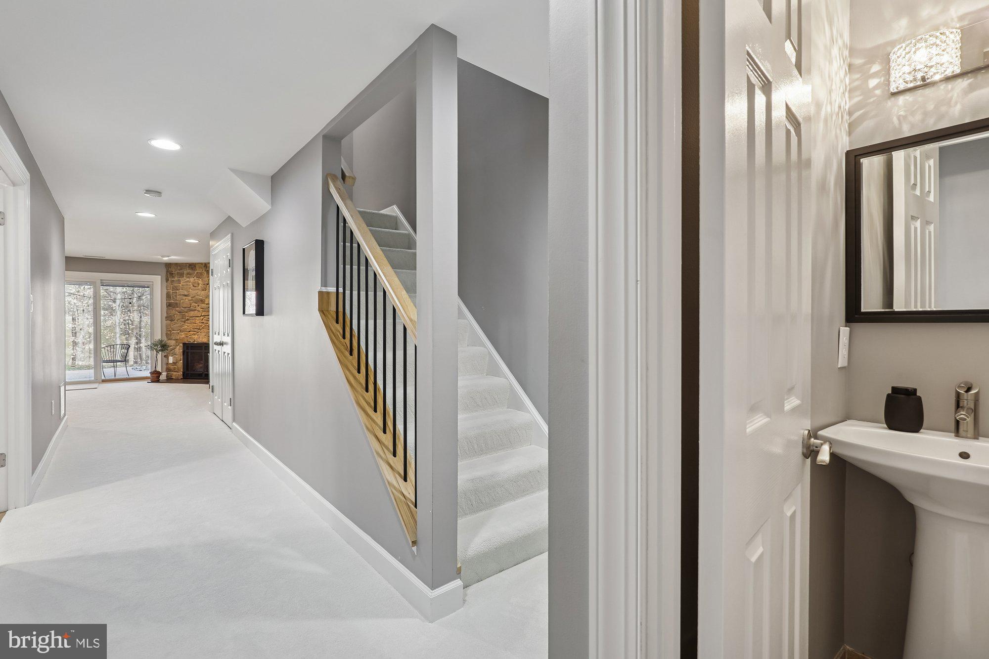 8019 Galla Knoll Circle Springfield, VA 22153 - Photo 39 of 57 a view of hallway with stairs and wooden floor