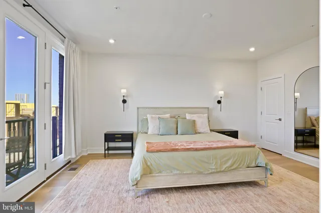 a bedroom with a bed and a view of bedroom