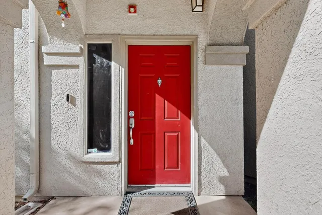 a view of a red door in the house