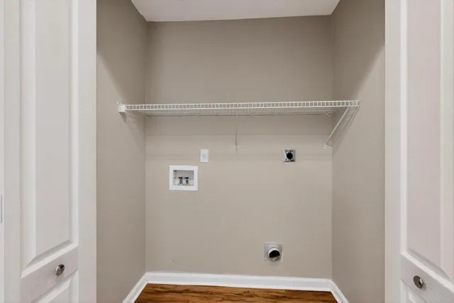 a bathroom with a granite countertop sink mirror vanity and toilet