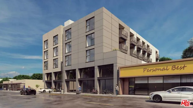 a view of a building with car parked