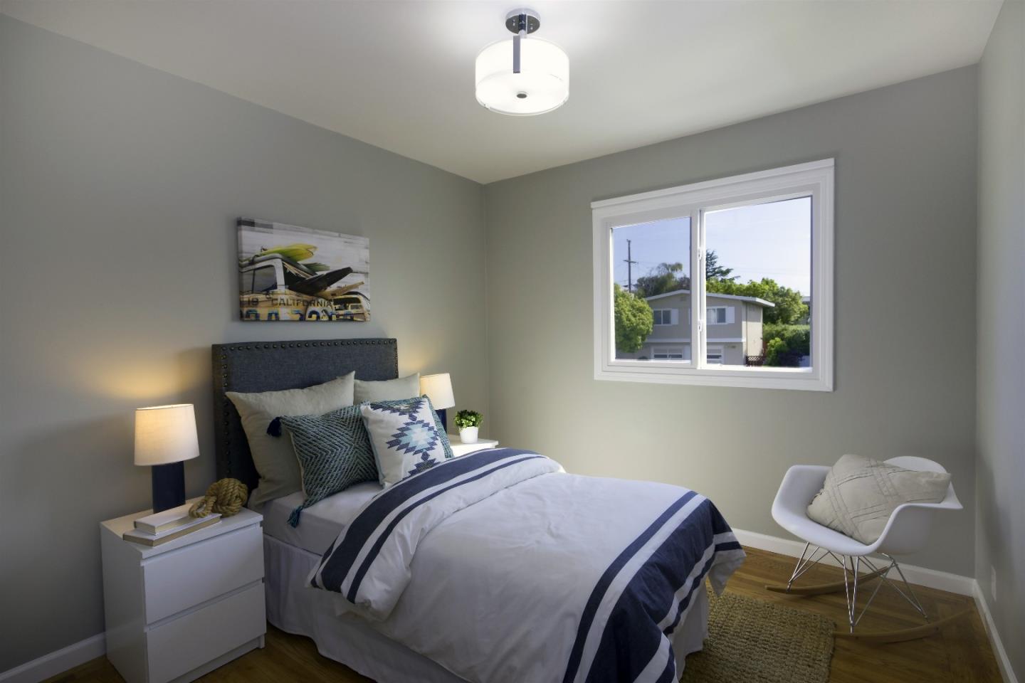 1179 Glenwood Drive Millbrae, CA 94030 - Photo 13 of 21 a bedroom with a bed and a chair