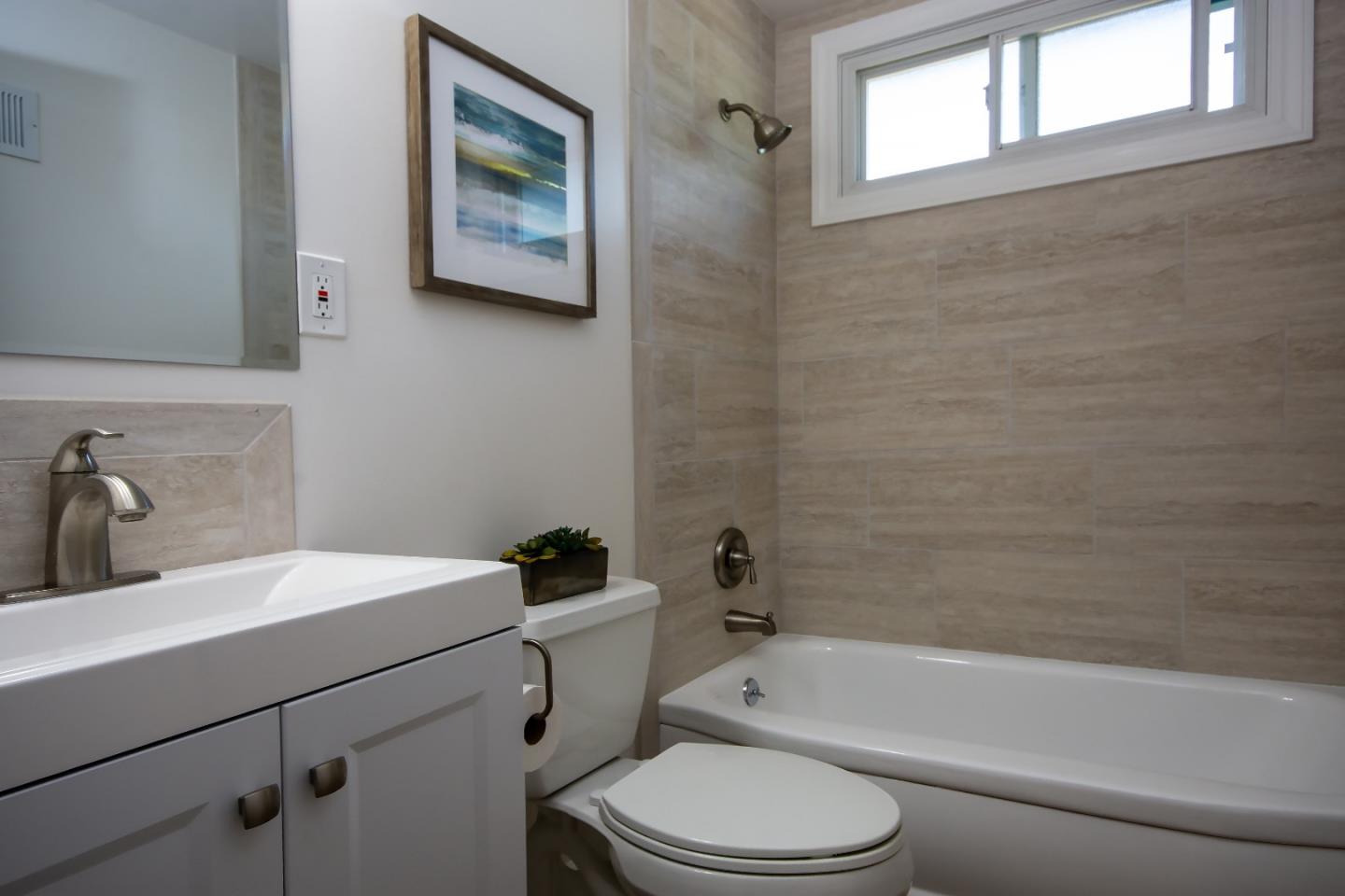 1179 Glenwood Drive Millbrae, CA 94030 - Photo 15 of 21 a bathroom with a sink toilet and bathtub