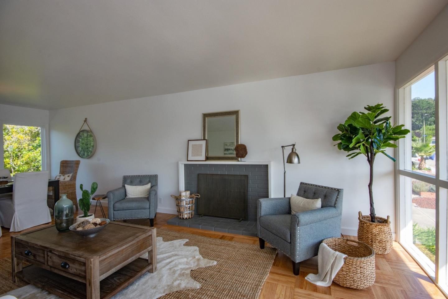 1179 Glenwood Drive Millbrae, CA 94030 - Photo 2 of 21 a living room with furniture and a potted plant