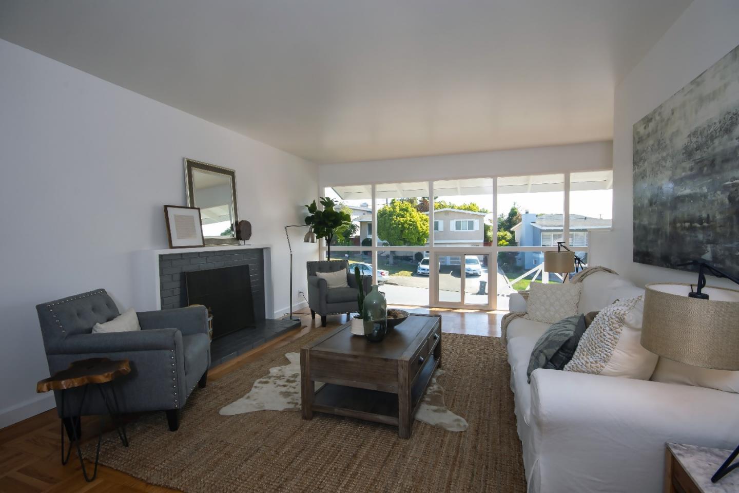 1179 Glenwood Drive Millbrae, CA 94030 - Photo 3 of 21 a living room with furniture and a fireplace