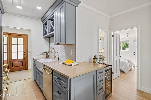 a view of a dining room with furniture and a chandelier