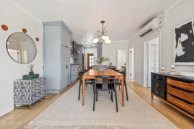 a view of a chairs and table in a window of a living room