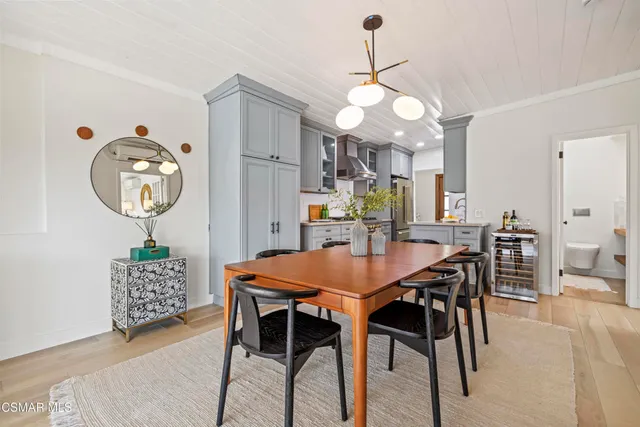 a spacious bedroom with a bed next to a large window with the outer view
