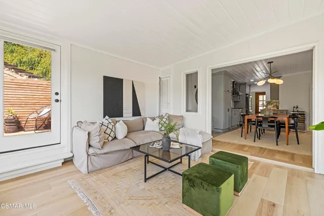 a bathroom with a granite countertop toilet a sink and a mirror