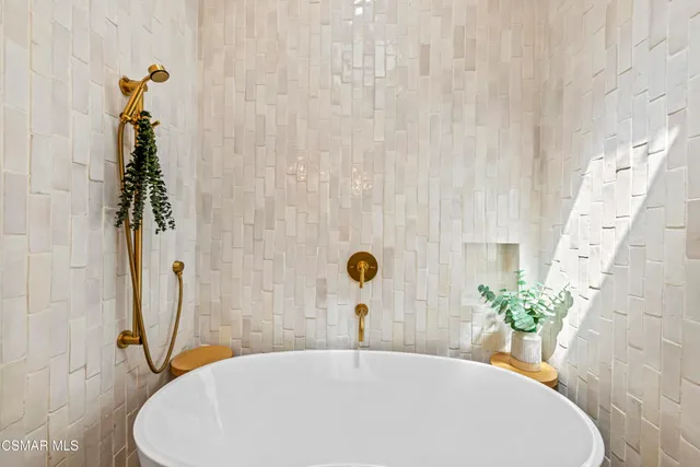 a view of a house with pool and wooden bench