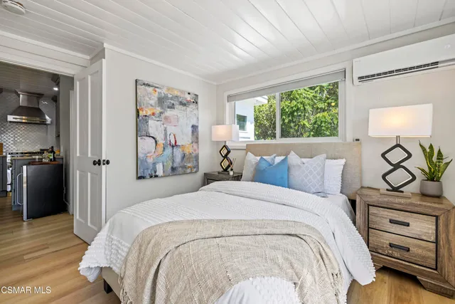 a view of balcony with wooden floor and outdoor seating
