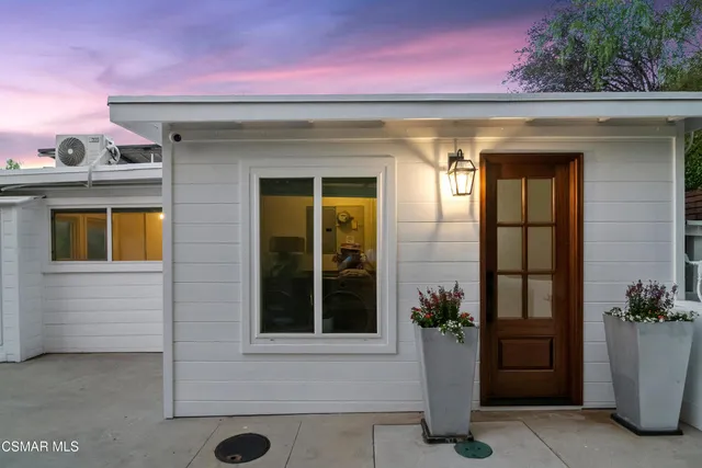 a front view of a house with a porch
