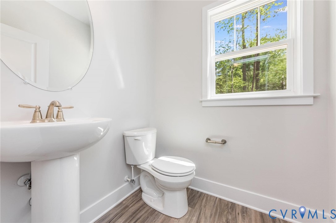 200 Victoria Drive Ruther Glen, VA 22546 - Photo 5 of 30 a bathroom with a toilet sink and mirror