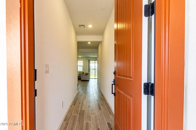 a view of a bathroom from the hallway