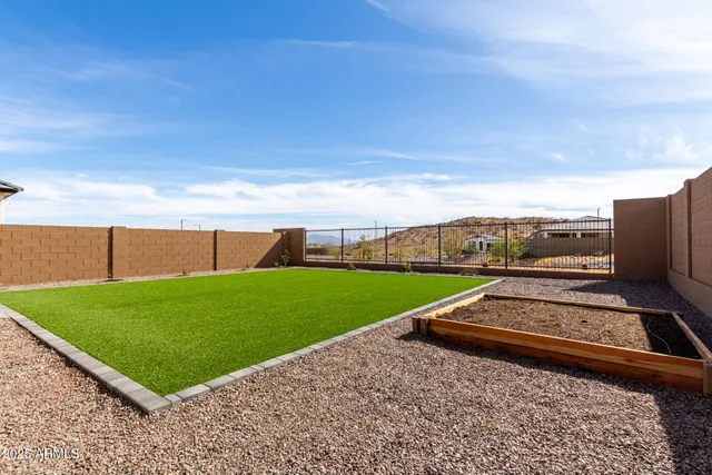 a view of a backyard with outside space