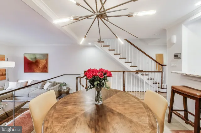a bedroom with furniture and a potted plant