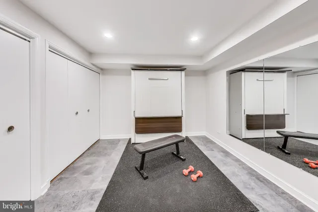 a spacious bedroom with a bed and a couch