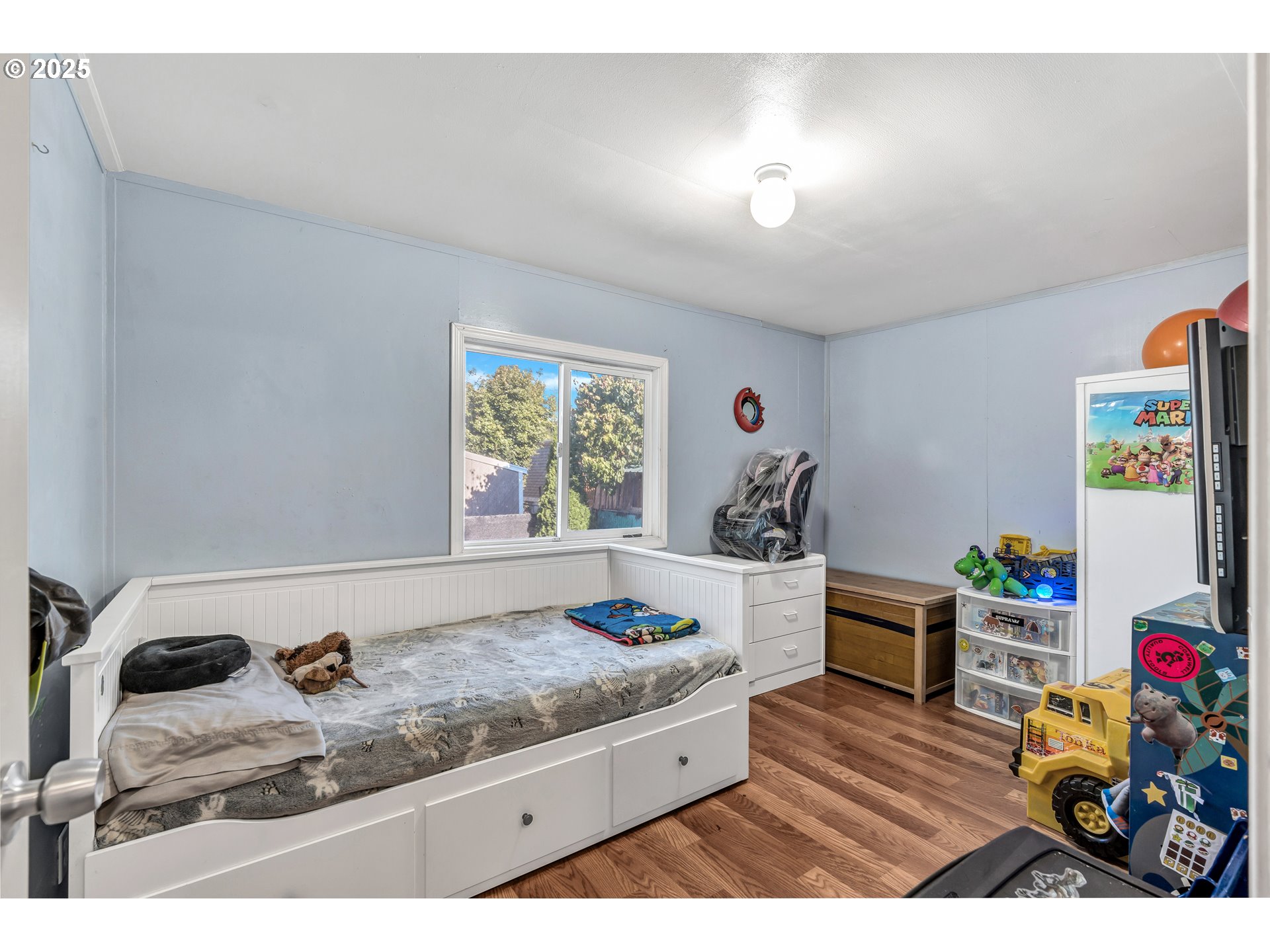 5885 Northeast Jacobson Street, Unit 70 Hillsboro, OR 97124 - Photo 12 of 29 a living room with hard wood flooring and a couch