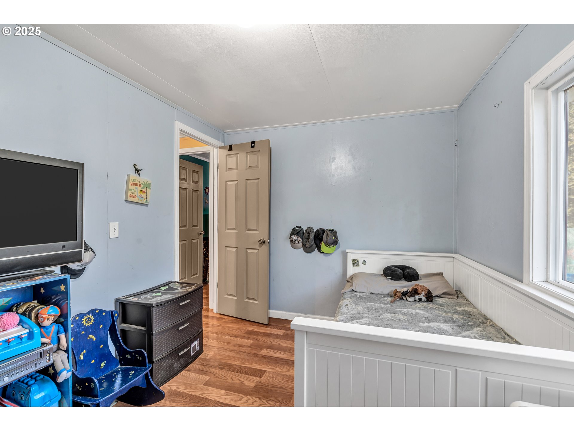 5885 Northeast Jacobson Street, Unit 70 Hillsboro, OR 97124 - Photo 13 of 29 a living room with furniture and a flat screen tv