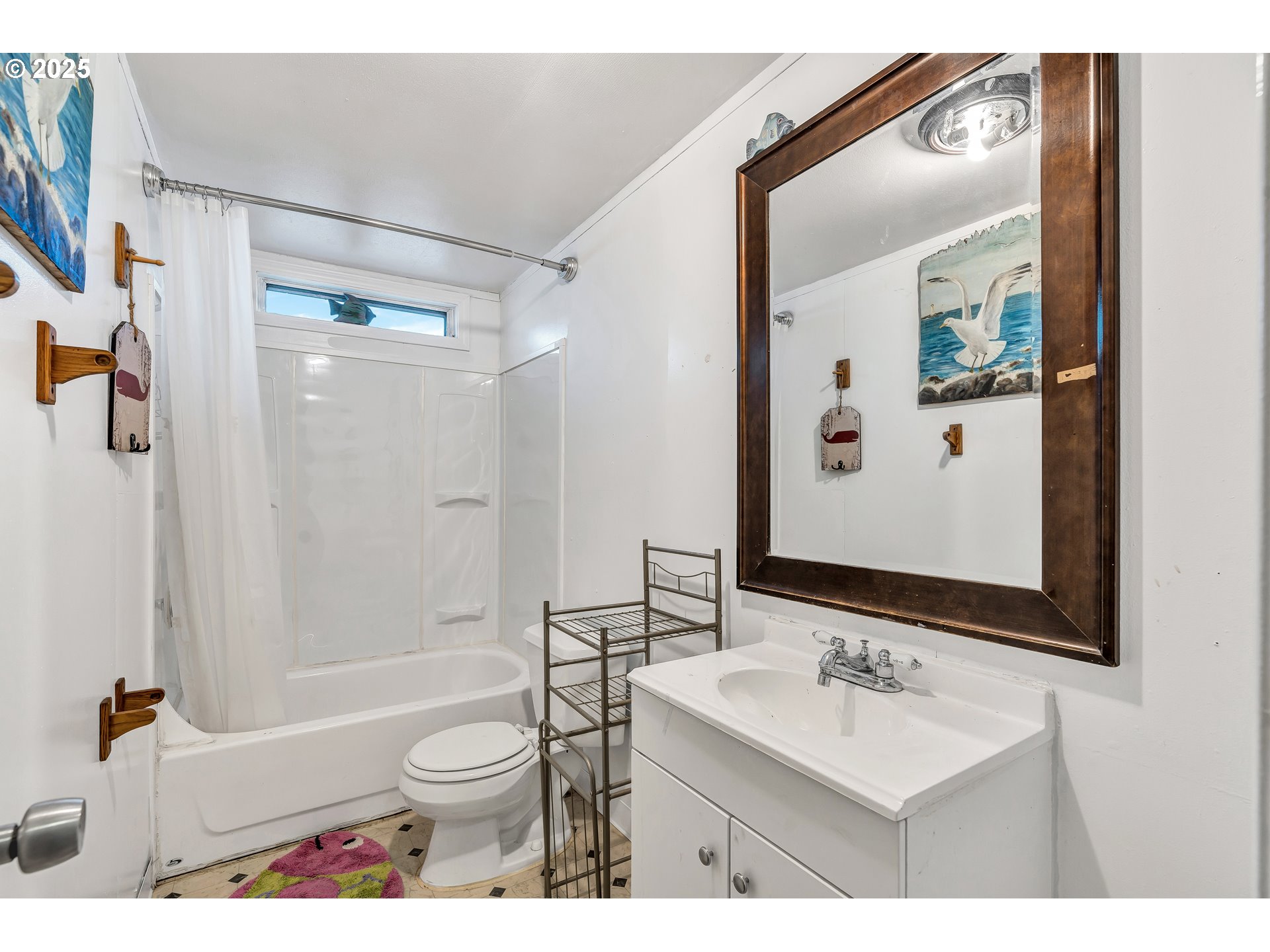 5885 Northeast Jacobson Street, Unit 70 Hillsboro, OR 97124 - Photo 16 of 29 a bathroom with a sink a toilet and shower